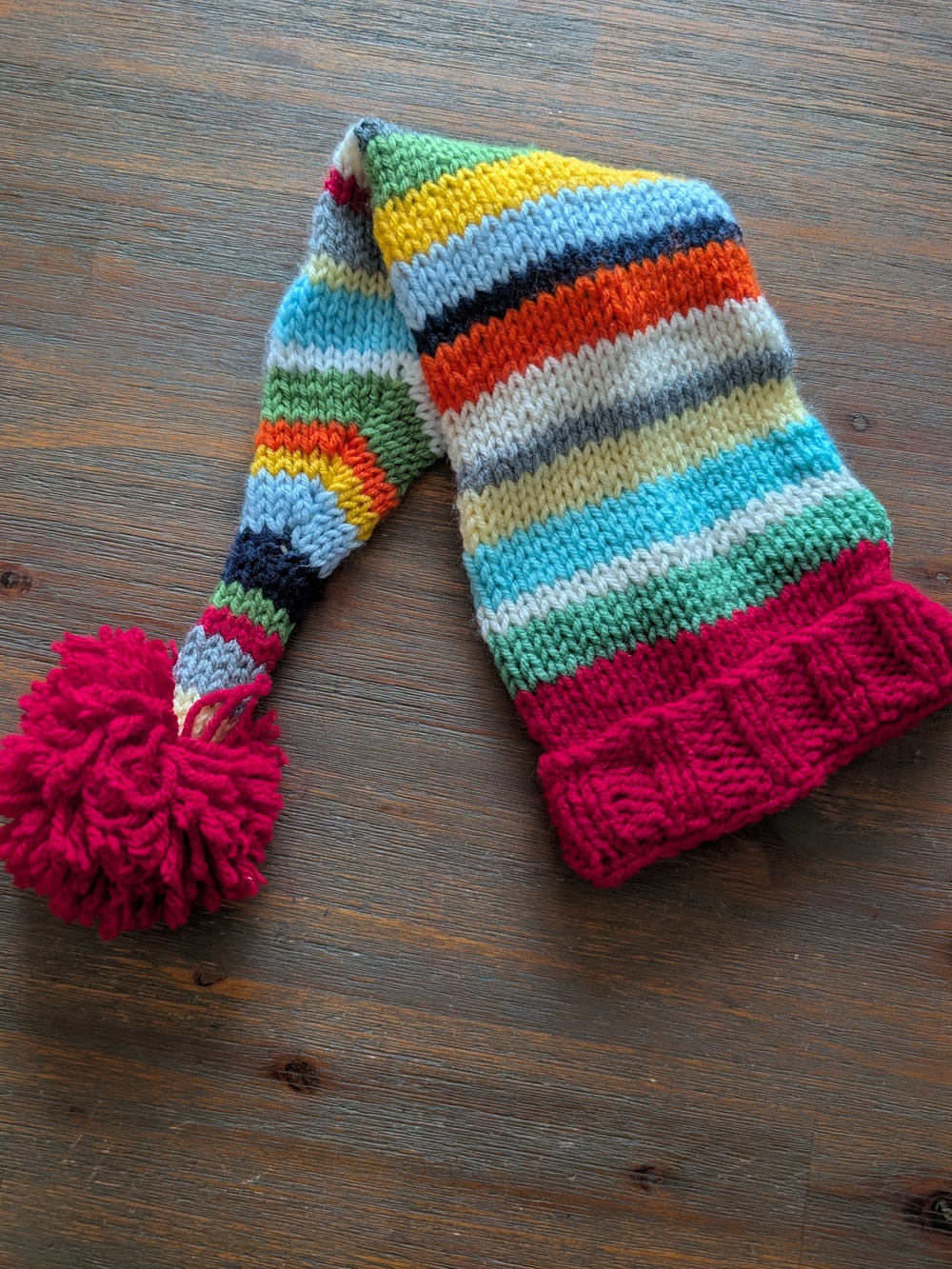 Baby's Multicolor Striped Knit Hat with Red Pom